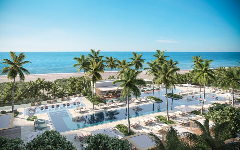 Pool Shot 1 Resort pool deck with palm trees and loungers at W Hotel & Residences Pompano Beach overlooking the ocean